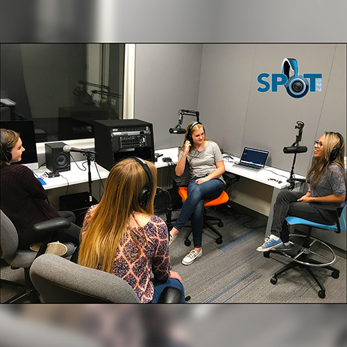 Four SPOT students in the studio interviewing each other.