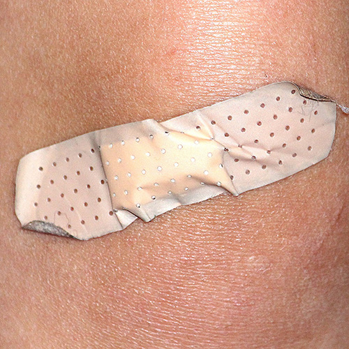 Bandaid on person's skin